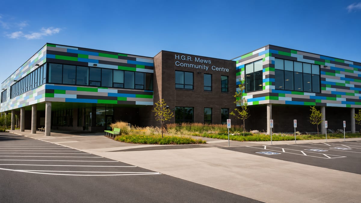 H.G.R. Mews Community Centre — exterior with green, blue and grey panelled cladding