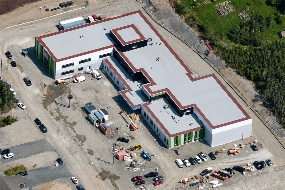 Portugal Cove-St. Philip's High School — aerial view of the school under construction, roofing complete and site works in progress